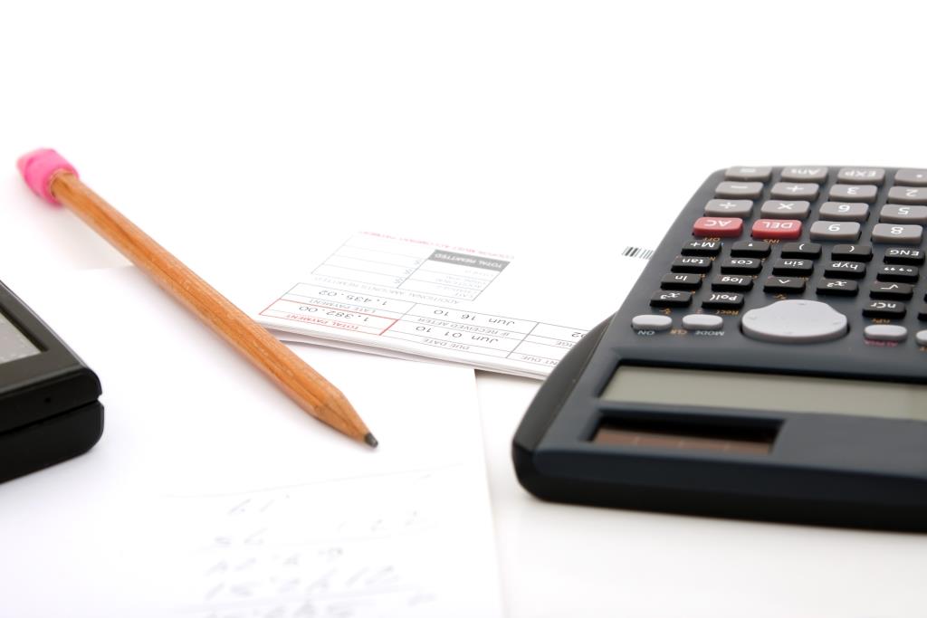 adding-up-the-monthly-expenses-for-household-accounting-a-calculator-pencil-and-paperwork-isolated-over-white_BtJ-vQDRBj (1)